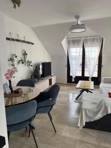 a living room with a table and a couch at Luz del Sur in Antequera