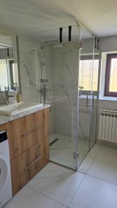 a bathroom with a shower and a sink at Vikendica 937 Lux & Spa, Istočno Sarajevo, Pale, Jahorina i Sarajevo na 15km in Pale