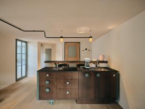 a kitchen with a sink and a counter top at Stuveles Apartments in Brixen +30 photos