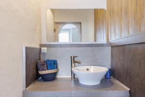 a bathroom with a white sink and a mirror at Lorali - Chambre d'Hôtes in Gohier +37 photos