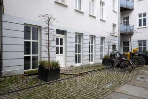 a group of bikes parked in front of a building at Central Apartment - Linienstraße in Berlin