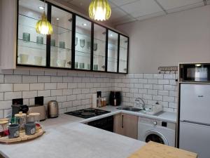a kitchen with a sink and a stove top oven at Melk Tert - Paarl - Self Catering Apartment in Paarl