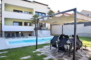 a villa with a swimming pool and a house at Villa Vincek in Mostar