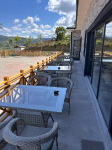 a row of tables and chairs on a patio at Grand Piramit Kanyon Hotel in Pınarbaşı +12 photos