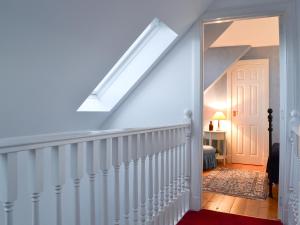 a stairway leading to a room with a skylight at Vindolanda in Fearnmore