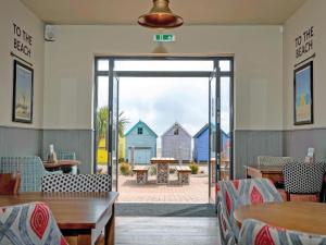 a restaurant with a view of the beach at Staying Inn in West Mersea