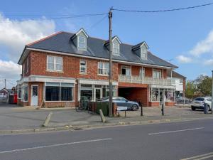 a large brick building on the corner of a street at Staying Inn in West Mersea +15 photos