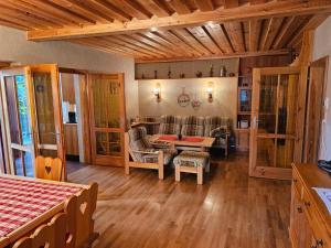 a living room with a couch and a table at Ferienhaus Teichalm in Lantsch
