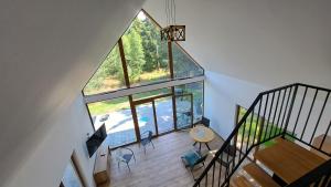 an overhead view of a living room with a large window at Echo Raduni in Stężyca