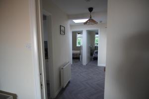 a hallway with a living room and a room with a radiator at Two Bed Flat Sea view Old town Hastings in Hastings