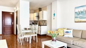 a living room with a couch and a table at 525 Aguamarina in San Miguel de Abona