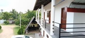 an external view of a house with a balcony at White House in Puttalam