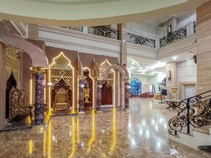 a lobby of a palace with gold furniture at Onih Hotel in Bogor +40 photos