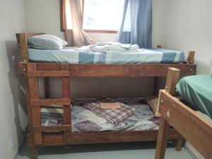 a pair of bunk beds in a room at quarto 3 pra 4 pessoas in Ouro Preto +7 photos