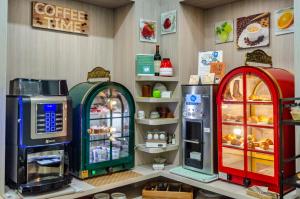 a store with three vending machines on a counter at Hotel Eden in Turin