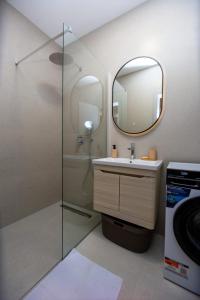 a bathroom with a sink and a mirror at Lastva Cozy apartment in Prijevor +10 photos