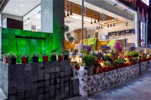 a store with potted plants inside of a building at Royal Mark Hotel in Sylhet