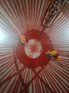 a red fan with a peace sign on it at Ак кайын in Chok-Tal