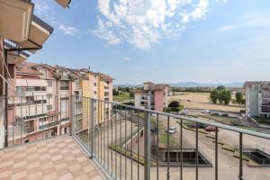a balcony with a view of a parking lot at Turin Airport apt B in Leinì
