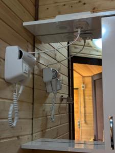 a pair of security cameras on a wall at Aisi in Jut'a