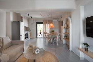 a living room with a couch and a table at Sea Salt Skiathos in Skiathos