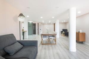 a living room with a couch and a table at Easylife - Como Villa Sofia Apartments in Como +137 photos