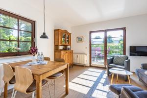 a living room with a table and chairs at Henriette in Ahrenshoop