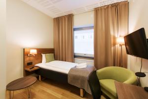 Postel nebo postele na pokoji v ubytování SPiS Hotell Naran
