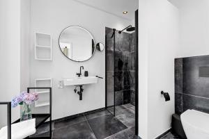 a bathroom with a sink and a mirror at Ferienwohnung Seaside App 9 List auf Sylt in List
