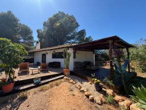a house with a porch and a patio at Can Jondalet in Sant Josep