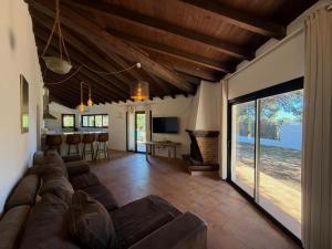 a living room with a couch and a table at Can Jondalet in Sant Josep