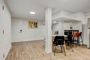 a dining room with a table and chairs in a room at Cozy 1 Br Apt with TV, Workstation, Kitchenette & Parking in Mississauga +10 photos