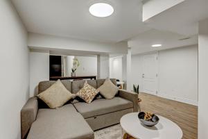 a living room with a couch and a table at Cozy 1 Br Apt with TV, Workstation, Kitchenette & Parking in Mississauga