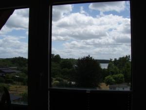 a window view of a lake from a house at Villa Mary in Lychen