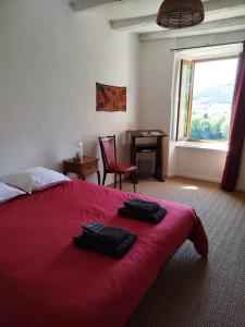 Voodi või voodid majutusasutuse La Bouriotte, chambre d'hôtes Sycomore, toas