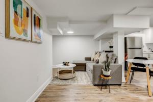 a living room with a couch and a table at Cozy 1 Br Apt with TV, Workstation, Kitchenette & Parking in Mississauga