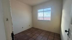 an empty room with a window and a tile floor at AbaHome Paiva in Cabo de Santo Agostinho