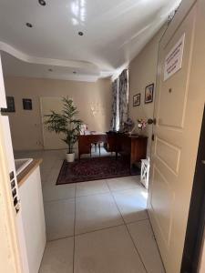 a hallway with a door and a table in a room at Casa Aurora in Ravenna