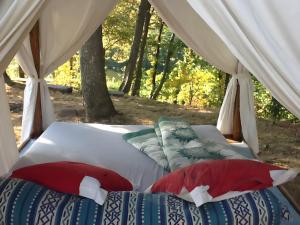 two beds in a tent in the woods at La Bruyère-Maison d'hôtes-Piscine in May-sur-Orne +19 photos