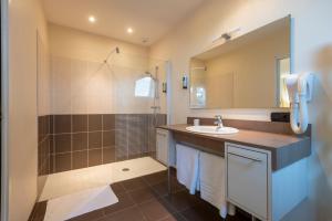 a bathroom with a sink and a shower at Résidence du Bas Mont in Moulay +78 photos