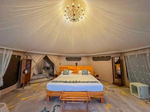 a bedroom with a bed in a tent at Royal Horizon Adventure in Sekenani