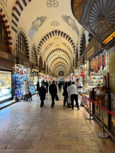 a group of people walking through a market at Hotel Gritti Pera & Spa in Istanbul