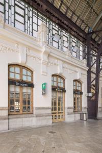a large building with two doors and windows at UP Hostel Valencia in Valencia