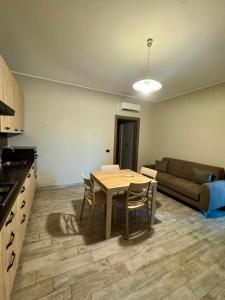 a living room with a table and a couch at ERMAN HOUSE - Dimora del Doge in Dolo