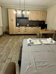 a kitchen with a table with towels on top of it at ERMAN HOUSE - Dimora del Doge in Dolo