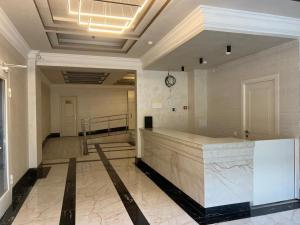 a lobby with a reception desk in a building at Guest Apart in Ozurgetʼi