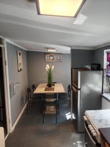 a dining room with a table and chairs at FjordHome in Flensburg +12 photos