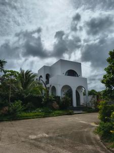 a white building on the side of a road at LaiKa in Phú Quốc +5 photos