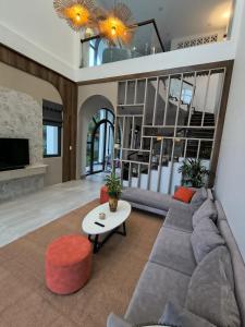 a living room with a couch and a table at LaiKa in Phú Quốc