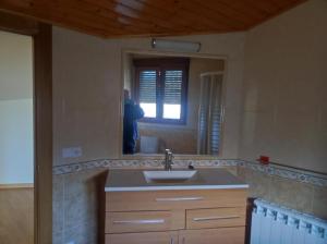 a person taking a picture of a bathroom mirror at Romanorum in Fermoselle +7 photos